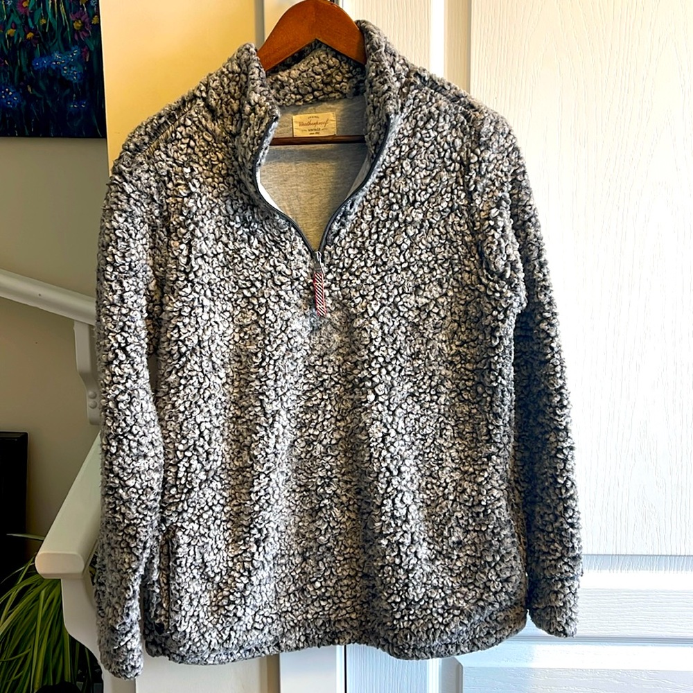 Weatherproof fluffy faux fur pullover coat with a half zipper and pockets